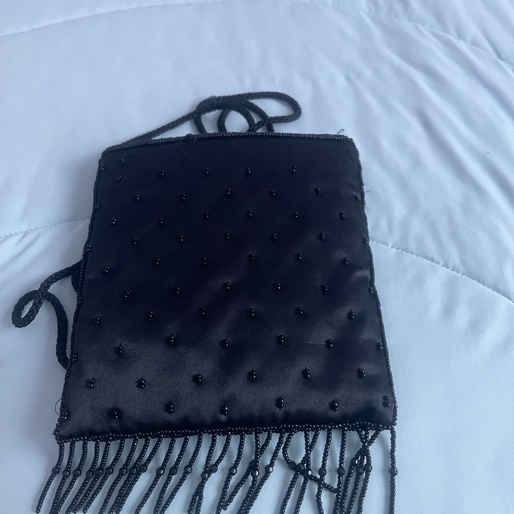 Satin beaded crossbody black purse.Zip closure. 6”x6”x1”  and 21” Handle - Picture 2 of 9
